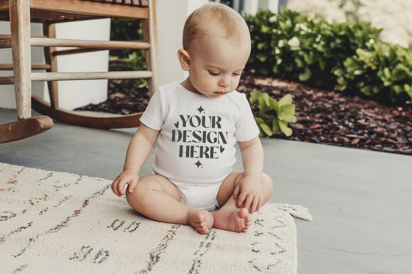 4400 Baby Bodysuit Flatlay Mockup for Graphics and Product Mockups